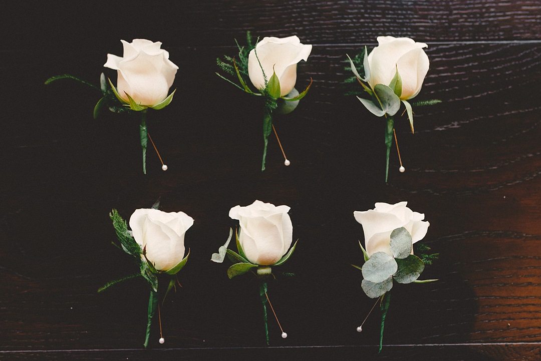 cream rose buttonholes and eucalyptus