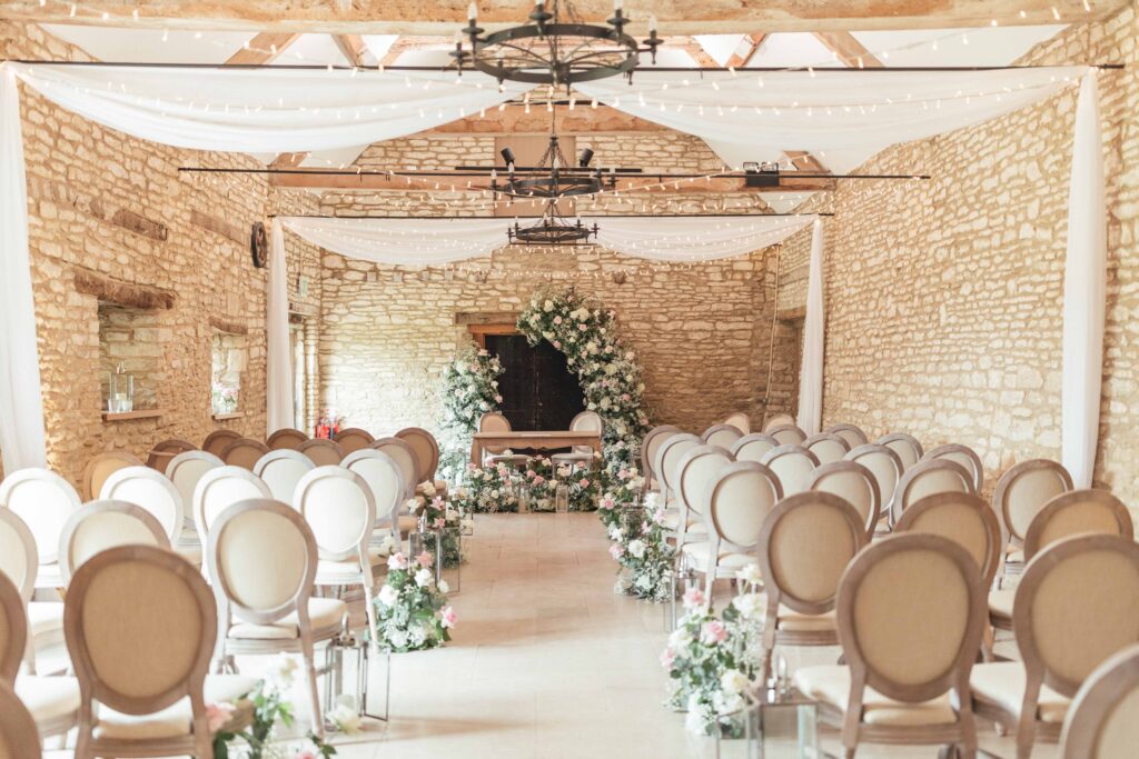 flower and candle lined ceremony aisle