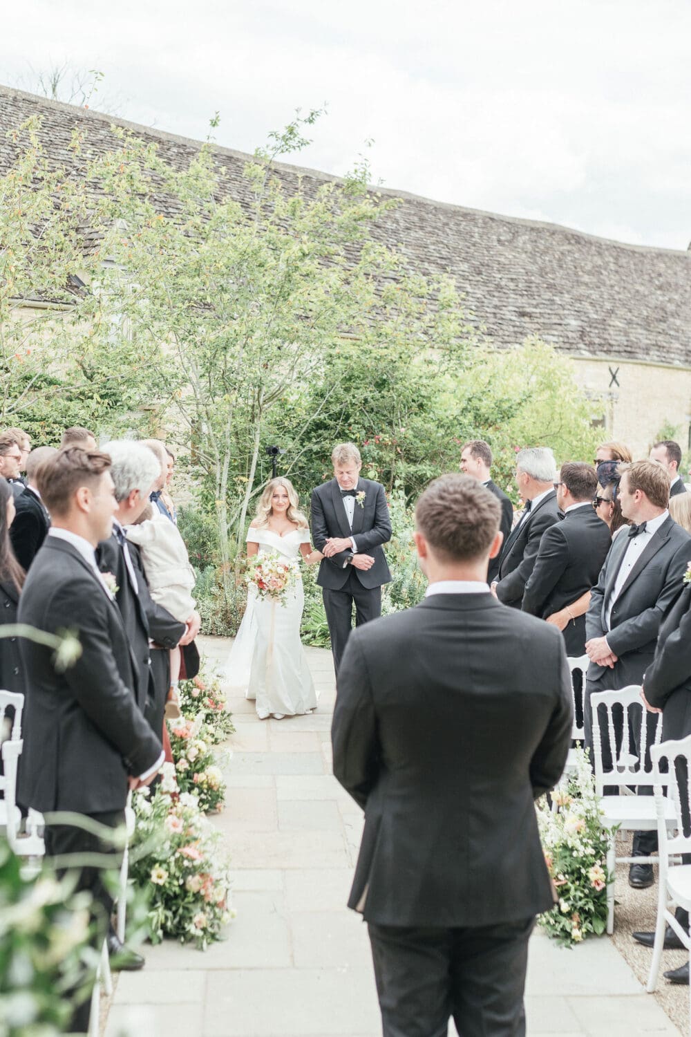 Outdoor ceremony in the walled garden at Caswell House Oxfordshire, summer wedding photography by Hannah McClune Photography